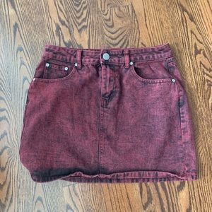 Pretty Little Thing’s Maroon Jean skirt